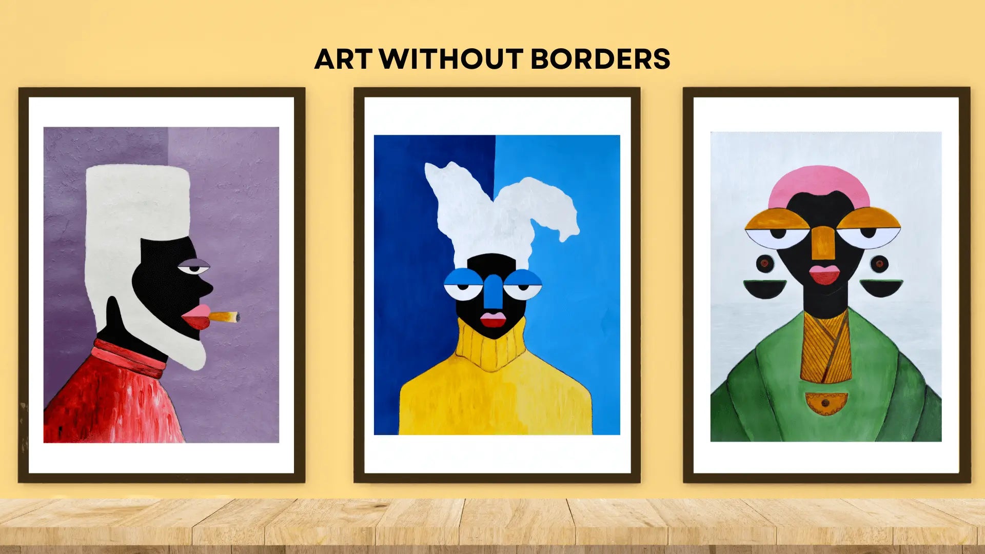 Three framed artworks with colorful abstract faces on a wooden shelf against a yellow wall, featuring 'Art Without Borders' text. Ghanaian art prints.